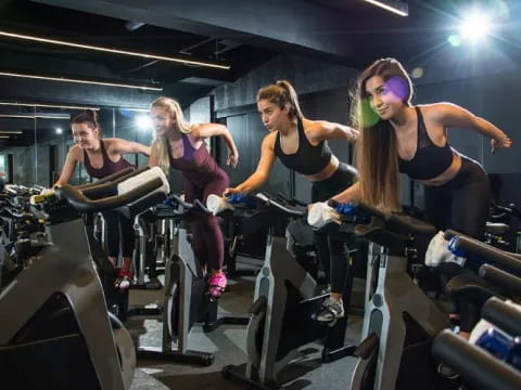 a group of women working out in a gym