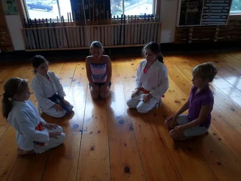 a group of children sitting on the floor