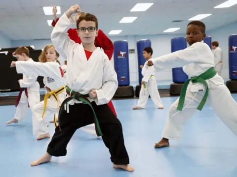 a group of people in karate uniforms