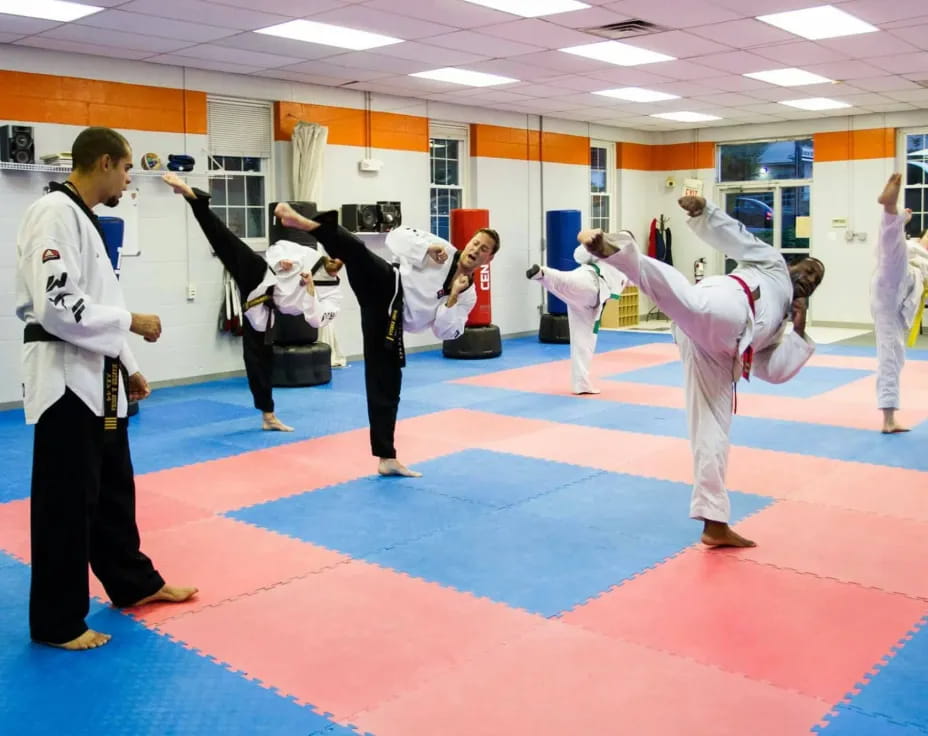 a group of people in karate uniforms