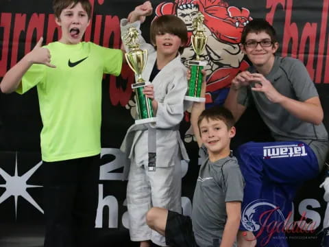 a group of people posing for a photo with a trophy