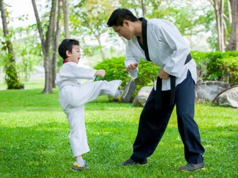 a man and a boy playing with a toy gun