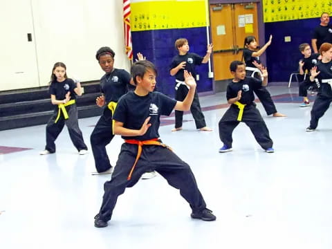 a group of kids in a karate class