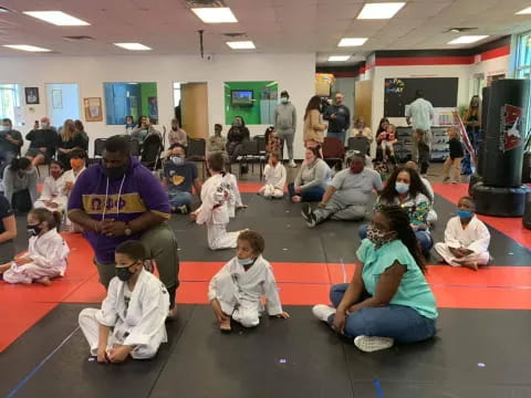 a group of people sitting on the floor