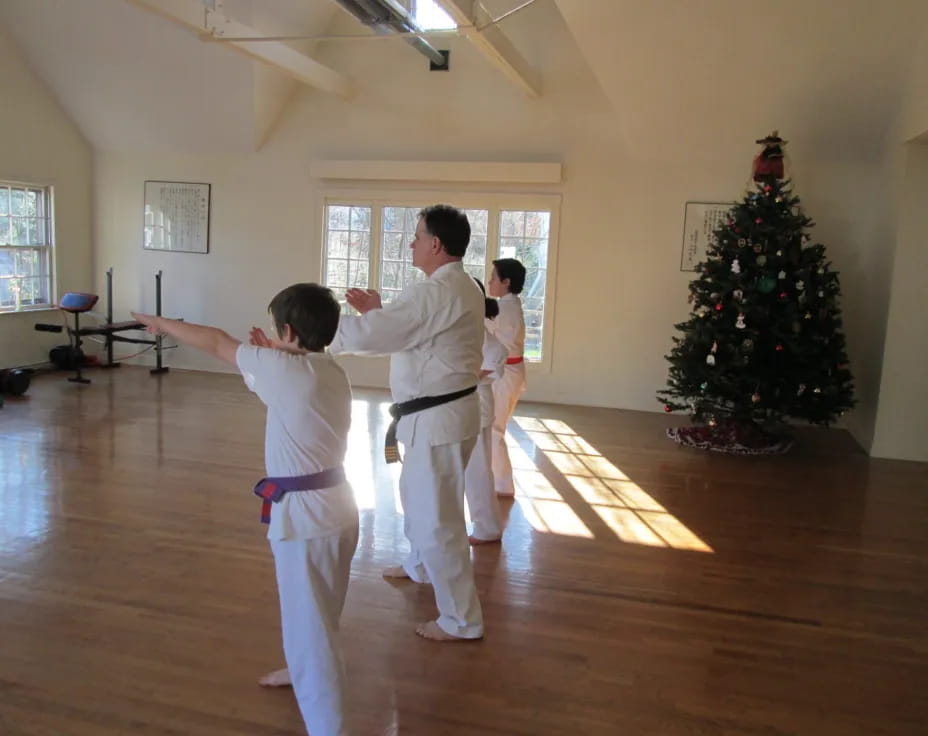 a group of people in karate uniforms