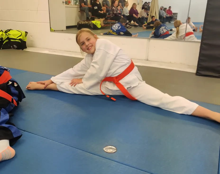 a boy lying on a mat