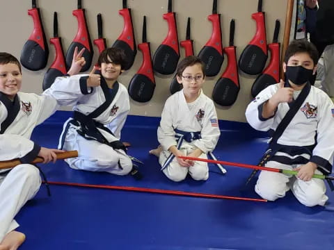 a group of people in karate uniforms