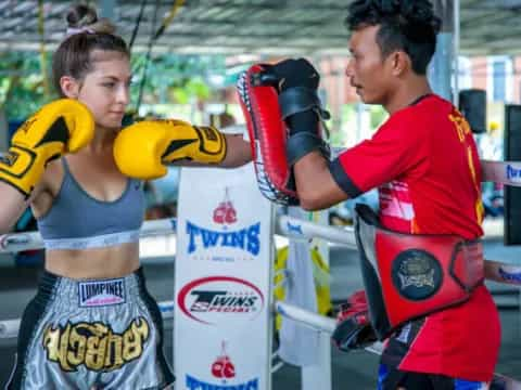 a man and a woman in boxing gloves