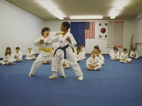 a group of people in karate uniforms