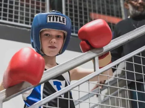a boy wearing boxing gloves