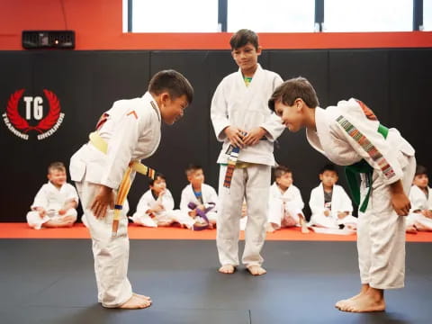 a group of people in karate uniforms