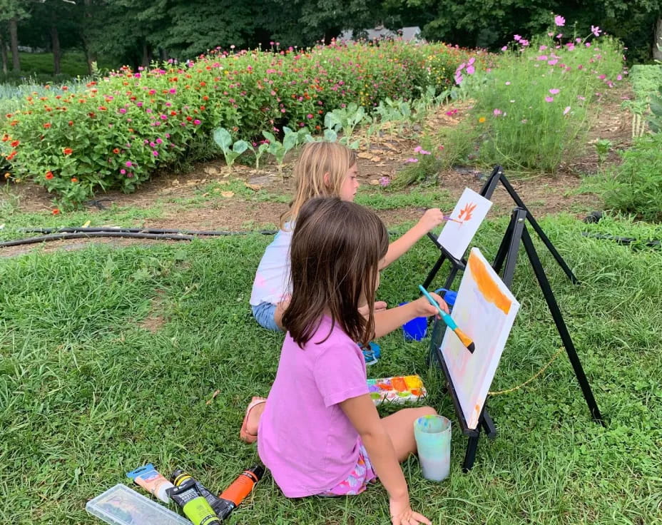 a couple of girls painting