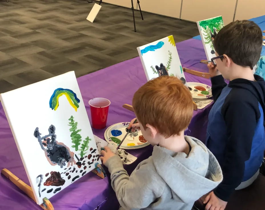 a group of people painting