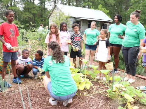 a group of people gathered around a garden