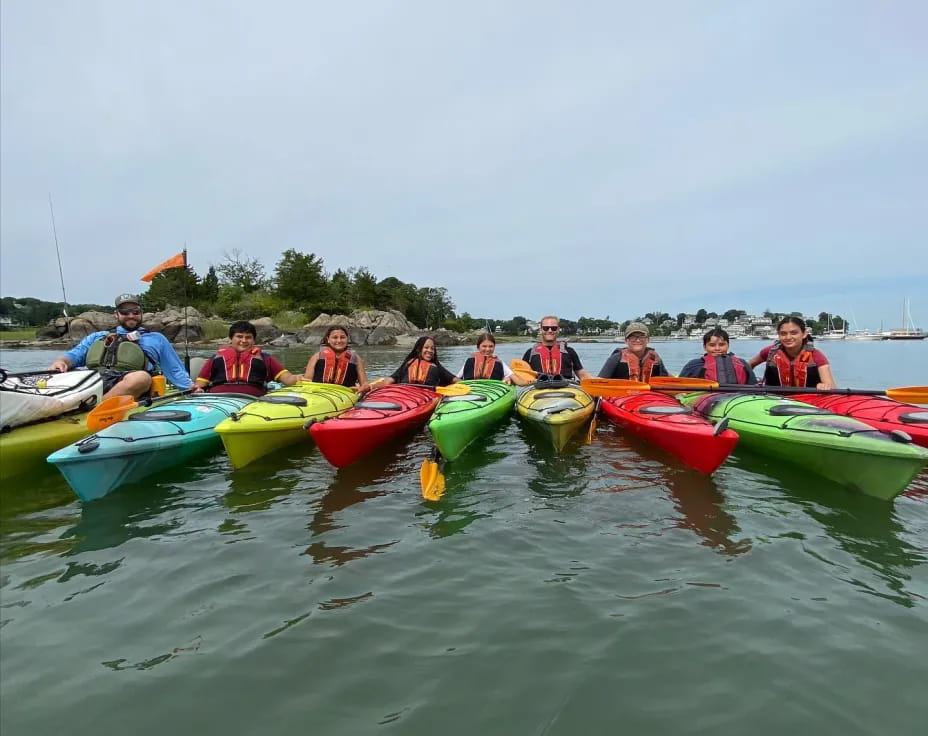 a group of people in kayaks