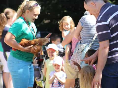 a group of people holding a bird