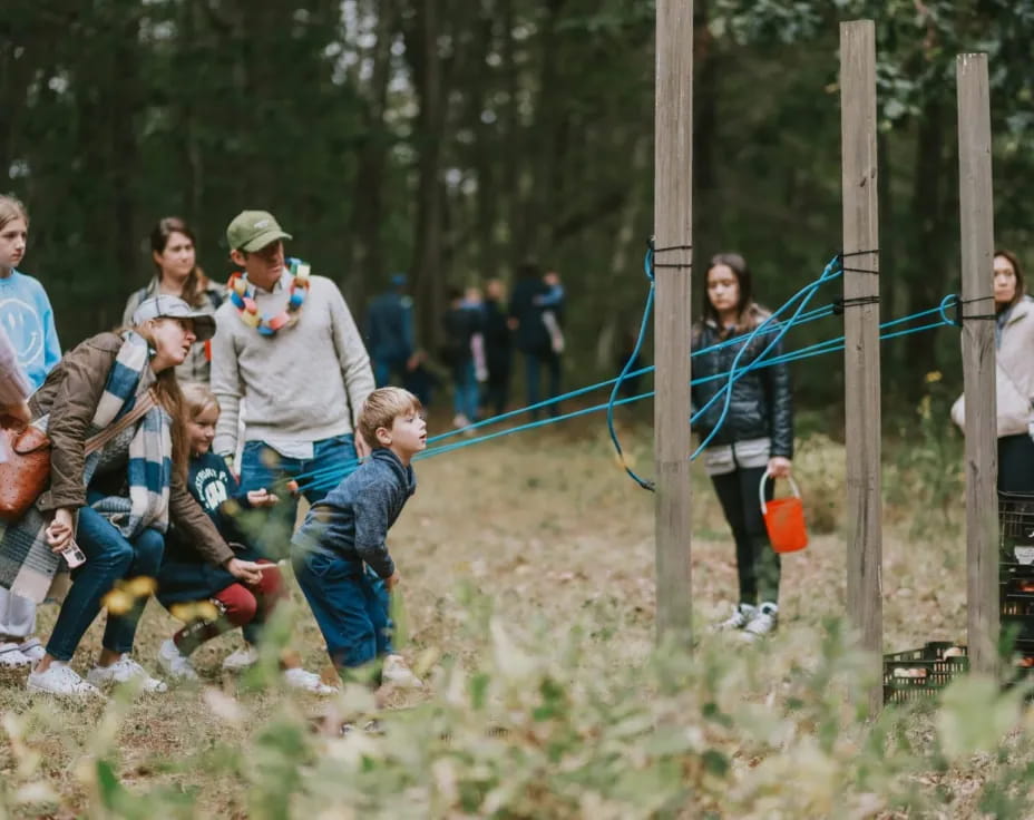 a group of people in a forest