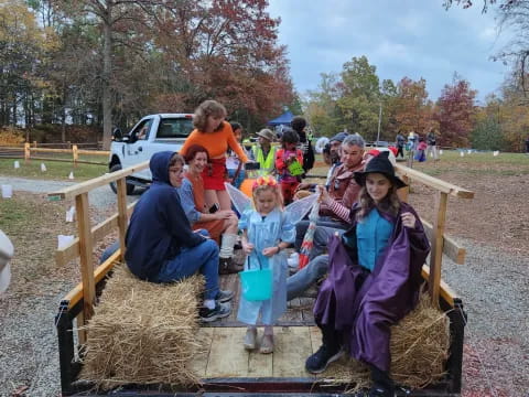 a group of people sitting on a bench in a park