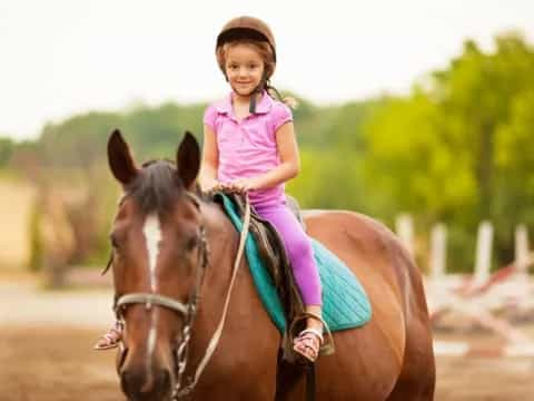 a girl riding a horse