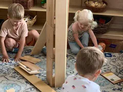 children playing with wooden blocks