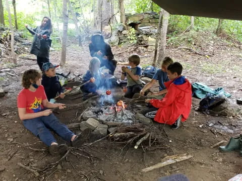 a group of people around a campfire