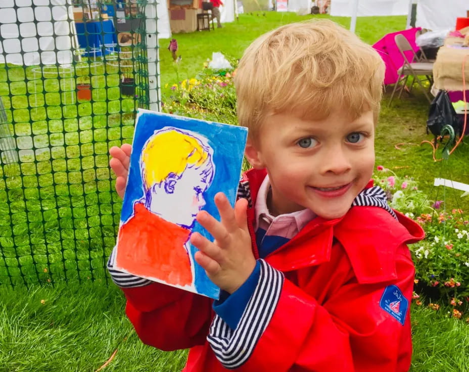 a boy holding a book