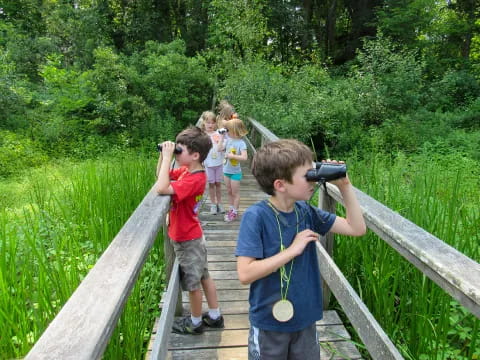 a group of kids taking pictures