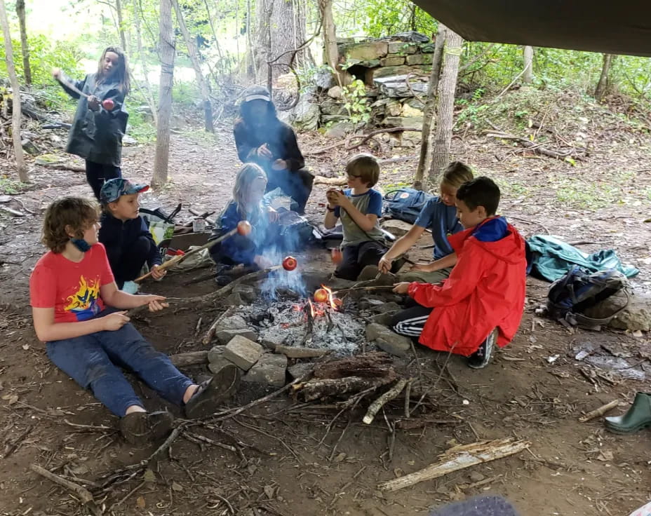 a group of people around a campfire