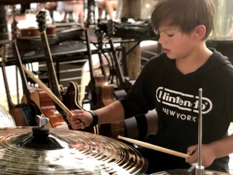 a boy playing the drums