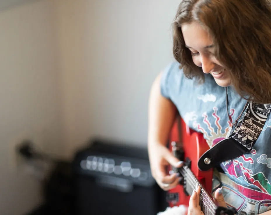 a person playing a guitar