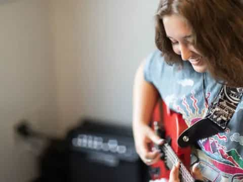 a person playing a guitar