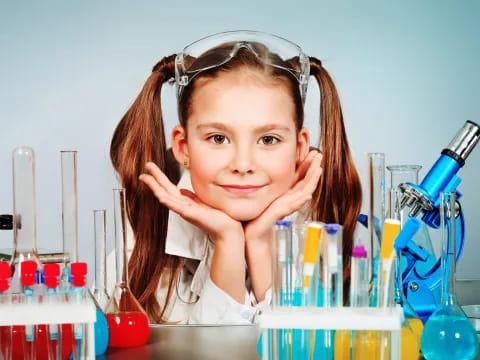 a young girl with her hands on her face