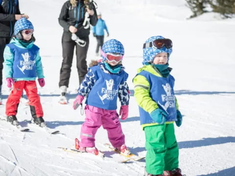 kids on skis in the snow