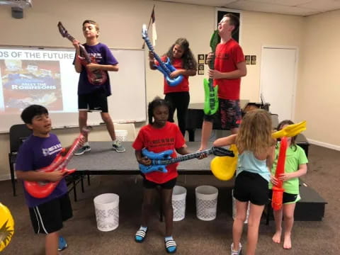 a group of kids playing with a toy