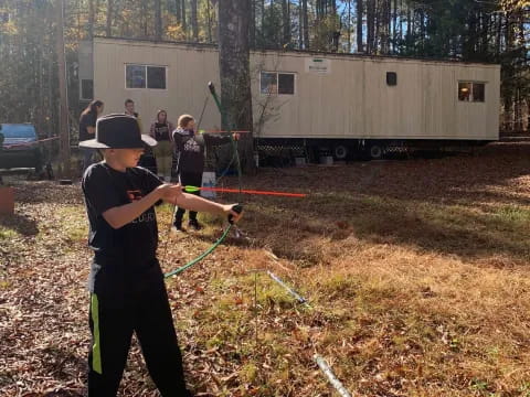 a person holding a bow and arrow