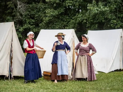 a group of women in dresses