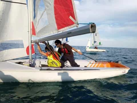 a group of people on a sailboat