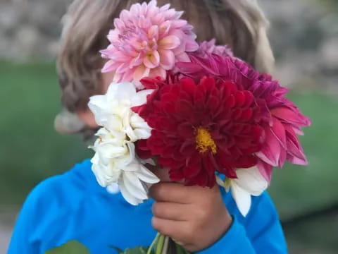 a child holding flowers