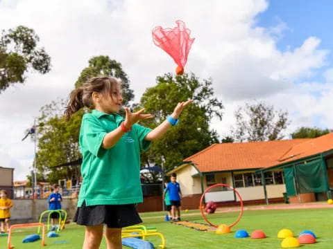 a girl flying a kite