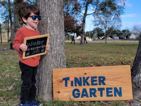 a boy holding a sign