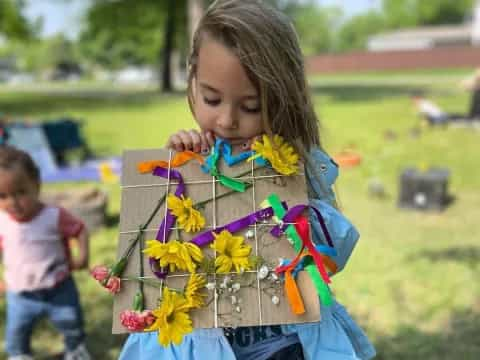 a girl holding flowers