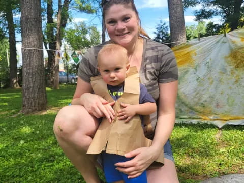 a person holding a baby