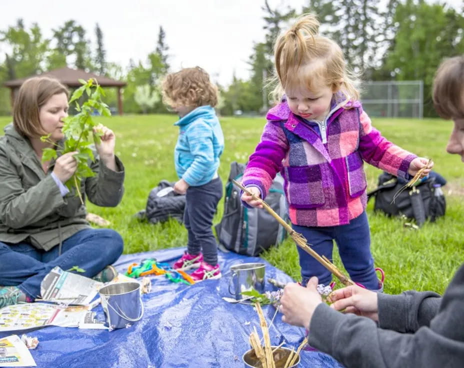 a group of people playing with toys