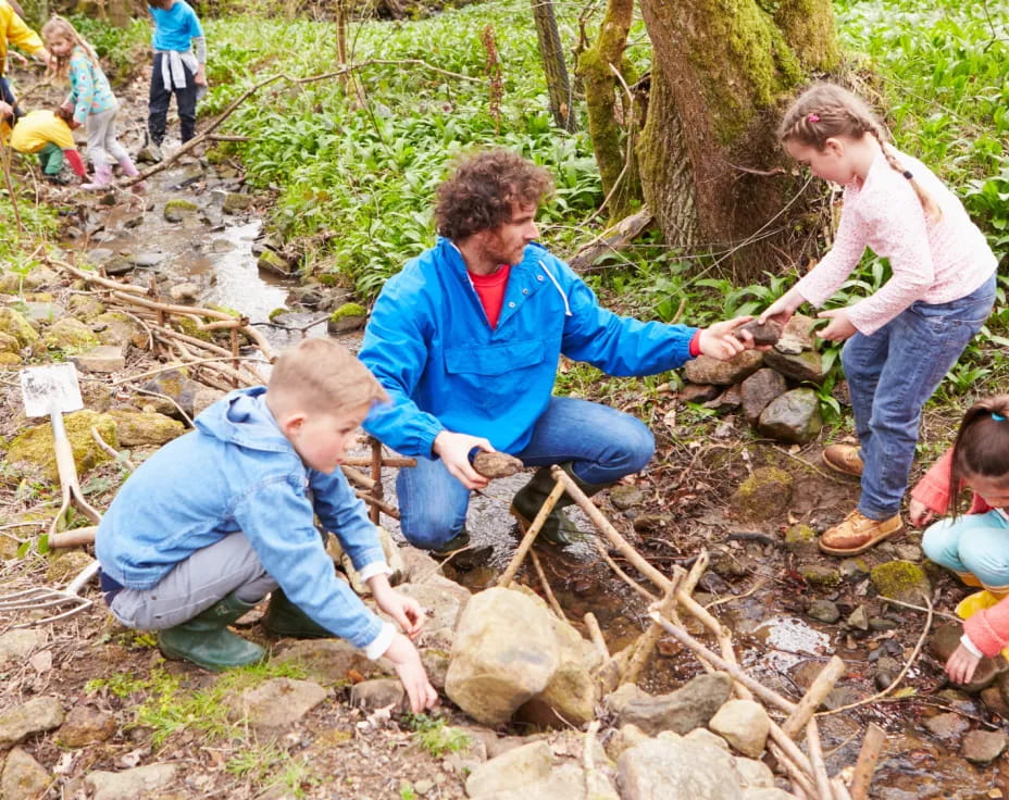 a group of people digging in the dirt