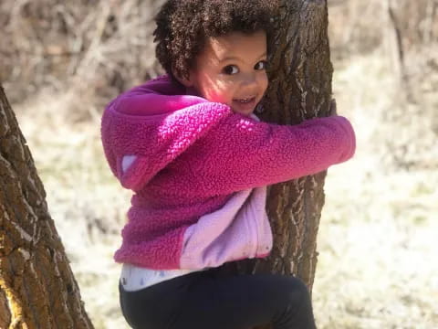 a child climbing a tree