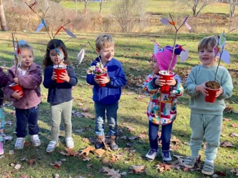 a group of children holding bows and arrows