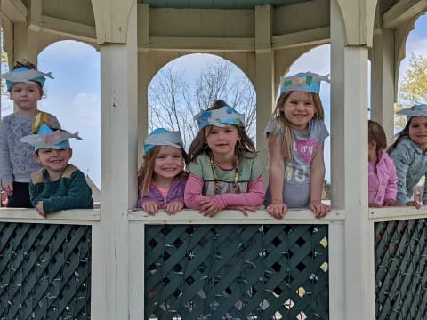 a group of children wearing hats