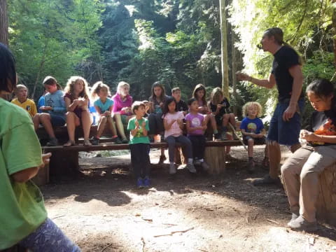 a group of people sitting on a bench