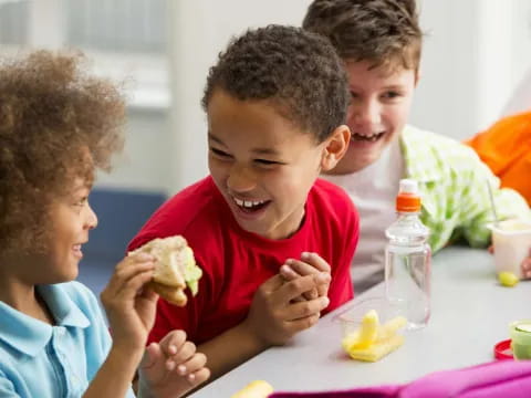 a group of kids eating