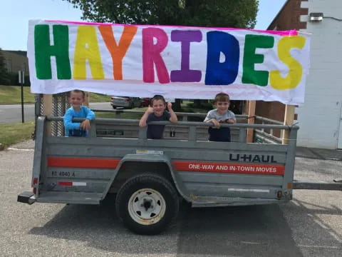 a group of kids in a truck